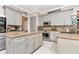 Modern kitchen featuring granite countertops, stainless steel appliances, and sleek, gray cabinets at 5103 Rushbrook Rd, Land O Lakes, FL 34638
