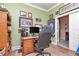 Home office with traditional desk, neutral walls, and decorative personal touches at 5103 Rushbrook Rd, Land O Lakes, FL 34638