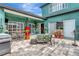 Covered patio featuring outdoor seating, grill, and a bar, ideal for entertaining and relaxing at 5103 Rushbrook Rd, Land O Lakes, FL 34638