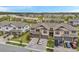 Aerial view of newly built townhomes featuring attached garages, neutral exteriors, and well-maintained landscaping at 5103 San Martino Dr, Wesley Chapel, FL 33543