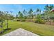 Expansive backyard and common area featuring well manicured lawn at 5103 San Martino Dr, Wesley Chapel, FL 33543