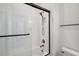Clean, bright bathroom features a tub with glass surround and chrome fixtures at 5103 San Martino Dr, Wesley Chapel, FL 33543
