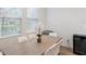 Elegant dining room featuring modern table with seating for six and a built-in wine refrigerator at 5103 San Martino Dr, Wesley Chapel, FL 33543