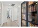 Hallway with hardwood floors and a built-in bookshelf at 5103 San Martino Dr, Wesley Chapel, FL 33543