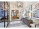Elegant hallway adorned with artwork, console table and decorative lighting fixtures at 5103 San Martino Dr, Wesley Chapel, FL 33543