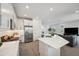 Open kitchen with quartz countertops and stainless steel appliances at 5103 San Martino Dr, Wesley Chapel, FL 33543
