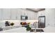 Well-equipped kitchen with stainless steel appliances and white cabinetry at 5103 San Martino Dr, Wesley Chapel, FL 33543