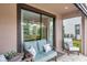 Inviting patio seating area with stylish outdoor furniture and sliding glass doors at 5103 San Martino Dr, Wesley Chapel, FL 33543