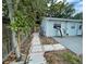 Backyard featuring a concrete path with grass at 5111 28Th N Ave, St Petersburg, FL 33710