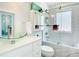 Modern bathroom featuring stylish vanity with glass sink, sleek fixtures, and updated subway tile at 5111 28Th N Ave, St Petersburg, FL 33710