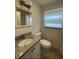 Bathroom featuring granite vanity and ample lighting at 5111 28Th N Ave, St Petersburg, FL 33710