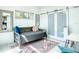 Cozy bedroom features a daybed, stylish rug, and modern sliding barn doors at 5111 28Th N Ave, St Petersburg, FL 33710