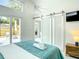 Bright bedroom with sliding barn doors, modern finishes and access to outdoor patio space at 5111 28Th N Ave, St Petersburg, FL 33710