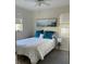 Comfortable bedroom featuring hardwood floors, natural light, and a plush bed at 5111 28Th N Ave, St Petersburg, FL 33710