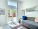Bright bedroom with daybed and access to a cozy outdoor lounge space at 5111 28Th N Ave, St Petersburg, FL 33710