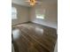 Bright bedroom featuring hardwood floors and natural light at 5111 28Th N Ave, St Petersburg, FL 33710