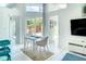 Bright dining area features modern table set and views of the backyard at 5111 28Th N Ave, St Petersburg, FL 33710