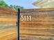 Close-up view of the wooden privacy fence displaying the house number at 5111 28Th N Ave, St Petersburg, FL 33710