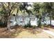 Quaint single-story home with mature landscaping and a walkway leading to the front door at 5111 28Th N Ave, St Petersburg, FL 33710