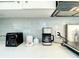 Close-up of countertop with coffee maker, toaster, and modern decor at 5111 28Th N Ave, St Petersburg, FL 33710