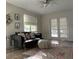 Living room featuring natural light, hardwood floors, and a comfortable sectional sofa at 5111 28Th N Ave, St Petersburg, FL 33710