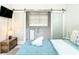Stylish bedroom features modern closet, soft lighting, and sleek sliding doors at 5111 28Th N Ave, St Petersburg, FL 33710