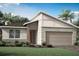 Beautiful new home featuring stone accents, modern design, and a two-car garage at 5120 125Th E Ave, Parrish, FL 34219