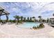 Resort-style pool with sun loungers, lush landscaping, and a covered lounge area perfect for relaxation at 5120 125Th E Ave, Parrish, FL 34219