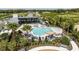 Aerial view of the resort style pool area with ample lounging and lush tropical landscaping at 5120 125Th E Ave, Parrish, FL 34219