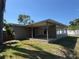 View of the backyard with a covered patio area at 5813 Oxford Dr, Tampa, FL 33615