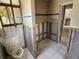 Bathroom showing a new toilet and shower area prepped for renovation at 5813 Oxford Dr, Tampa, FL 33615