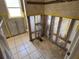 Bathroom features tiled walls and floor, with a prepped renovation space at 5813 Oxford Dr, Tampa, FL 33615