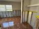 Bedroom has tile flooring, a closet and window, prepped for renovation at 5813 Oxford Dr, Tampa, FL 33615