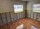 Bedroom featuring tile floor and natural light at 5813 Oxford Dr, Tampa, FL 33615