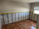 Bedroom featuring a window, tiled floor, and a view of the room's interior at 5813 Oxford Dr, Tampa, FL 33615