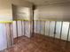 Bedroom showing tiled floors, closet and a wall with a window at 5813 Oxford Dr, Tampa, FL 33615