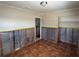 Bedroom featuring tile floor with closet and bathroom access at 5813 Oxford Dr, Tampa, FL 33615