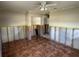 Bedroom featuring tile flooring and two closets, prepped for renovation at 5813 Oxford Dr, Tampa, FL 33615