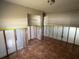 Bedroom view shows tile flooring, closet and walls prepped for renovation at 5813 Oxford Dr, Tampa, FL 33615