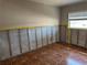 Bedroom featuring a window, tiled floor, and a view of the room's interior at 5813 Oxford Dr, Tampa, FL 33615