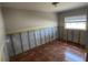 Bedroom featuring tile flooring, window, and walls prepped for renovation at 5813 Oxford Dr, Tampa, FL 33615