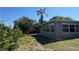 Yard features a palm tree at 5813 Oxford Dr, Tampa, FL 33615