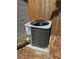 Exterior AC unit is on a concrete slab in the backyard at 5813 Oxford Dr, Tampa, FL 33615