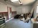 Spacious garage needing TLC with white walls and some appliances at 5813 Oxford Dr, Tampa, FL 33615