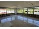 Spacious sun room featuring tile floors, lots of natural light, and a beautiful view of the adjacent canal at 5813 Oxford Dr, Tampa, FL 33615