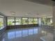 Sun room featuring tile floors, lots of natural light, and a beautiful view of the adjacent canal at 5813 Oxford Dr, Tampa, FL 33615