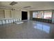 Large sun room featuring built-in shelving, tile floors and outdoor views at 5813 Oxford Dr, Tampa, FL 33615