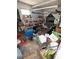 Basement area cluttered with various household items, storage bins, and miscellaneous debris at 6715 16Th N St, St Petersburg, FL 33702