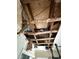 View of a damaged ceiling with exposed wooden beams and visible signs of water damage at 6715 16Th N St, St Petersburg, FL 33702