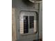 Close-up of an old electrical panel with labeled breakers and a main disconnect switch at 6715 16Th N St, St Petersburg, FL 33702